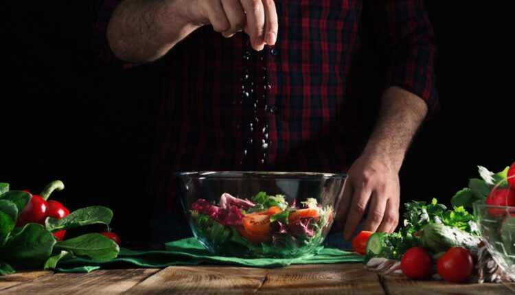 Chef-creating-and-seasoning-the-perfect-salad.jpg