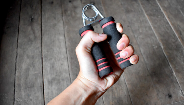 Hand-Exercising-Grip-Strength-With-A-Hand-Grip-.jpg