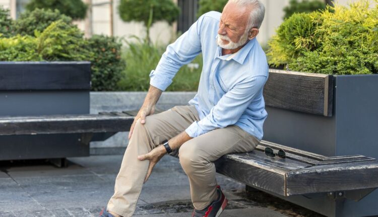 senior-businessman-with-knee-problems-in-the-city-royalty-free-image-1690216426.jpg