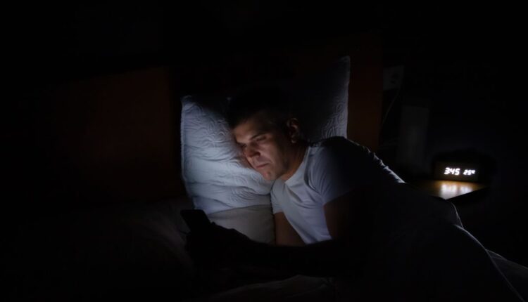 man-is-lying-in-bed-in-total-darkness-looking-at-royalty-free-image-1690838295.jpg