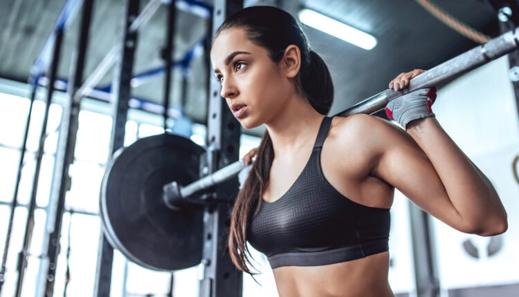 Young-Fit-Female-Focused-Intense-Barbell-Squat.jpg